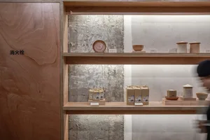 Store display with wooden shelves featuring bowls and bottles in an organized and inviting atmosphere