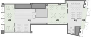 A large room with multiple dining tables, chairs, and an inviting atmosphere suitable for gatherings or meetings