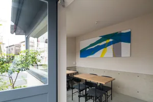 Cozy restaurant dining area with multiple tables and chairs, providing a comfortable environment for guests to enjoy their meals