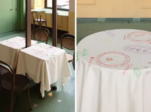 A dining area with a white tablecloth and three chairs, and a round table with a decorative tablecloth design