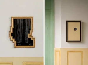 Modern interior design featuring a green wall with a framed mirror and a square frame with a hole, showcasing clean lines and minimalistic decoration