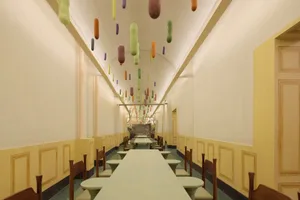 A clean and organized dining area with a long wooden table surrounded by metal or plastic chairs, ready for customers