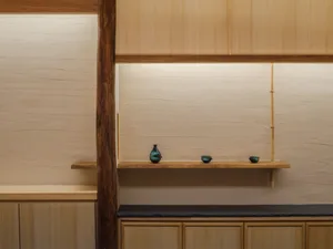 Wooden interior design with vases and bowls on shelves, creating a cozy and warm ambiance