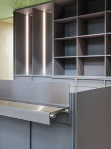 Office space with metal countertops, gray cabinets, and a clean contemporary design