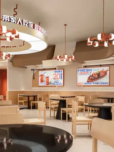 Empty restaurant with wooden tables and chairs, modern design, clean and well-organized atmosphere