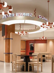 Warm and inviting restaurant interior with wooden tables and chairs, well-designed lighting, and a cozy atmosphere