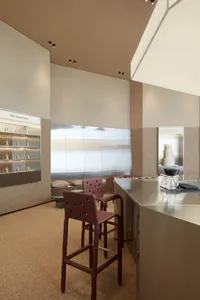 Modern restaurant interior with a large countertop, couches, and decorative elements