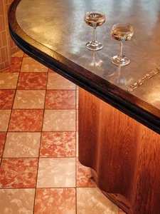 Warm and inviting kitchen scene with a wooden countertop, wine glasses, and a cozy atmosphere