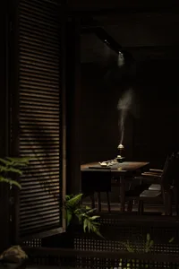 Warm and inviting Asian restaurant interior with wooden tables and chairs, featuring a cozy ambiance