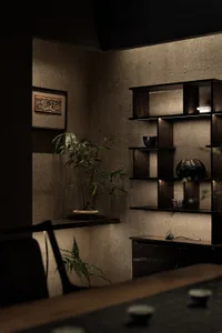 Cozy living room with a wooden bookshelf, potted plants, and decorative vases, creating a warm and inviting atmosphere