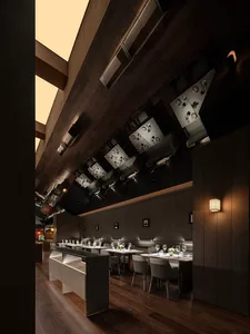 Dining area with wooden furniture, wine glasses, and well-lit surroundings