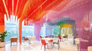 A restaurant dining area with multiple tables and chairs, creating a comfortable atmosphere for guests to enjoy their meals