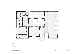 2D floor plan of a modern hotel or residential complex with various rooms and spaces, including a lobby, hallway, and multiple bedrooms