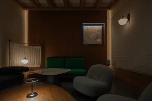 Cozy living space with a dining table, two couches, and a wooden floor, well lit and inviting