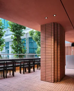 An inviting outdoor dining area with multiple tables and chairs, perfect for enjoying meals outside