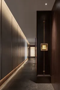 A quiet and peaceful hallway with wooden walls and floors, suggesting a well-maintained and clean environment