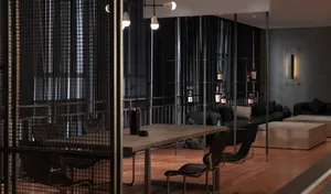 A modern office space with a wooden table surrounded by chairs, black walls, and a glass partition, creating a professional environment for collaboration and focus