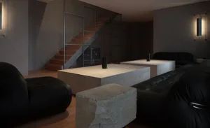 Cozy living room with a large couch, fireplace, chairs, dining table, TV, and staircase, creating a warm and inviting atmosphere