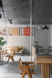 A cozy restaurant interior with multiple dining tables and chairs, inviting atmosphere, and comfortable seating