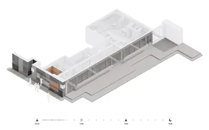 A modern building interior with white walls, multiple rooms, and hallways, well-lit by natural sunlight through windows