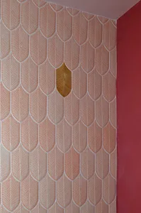 Ornate wall design featuring interlocking circles in various sizes on a wooden surface