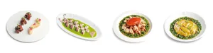 A formal dining setting with two plates of food, one with seafood and the other with meat, placed in front of a bowl in a restaurant-like environment
