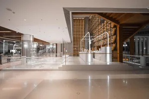 Large open space with high ceiling, featuring various statues and art pieces in an elegant and sophisticated atmosphere