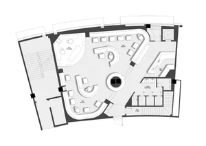 A modern building with multiple levels, including a basement, featuring a mix of open and enclosed spaces, clean lines, and minimalistic elements, with ample natural light and predominantly white materials