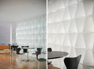 Dining area with a hexagonal wall, two dining tables, and modern furniture