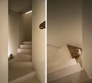 A historic staircase with stone and wooden walls, leading downwards with a rock at the bottom in one view, suggesting an abandoned structure
