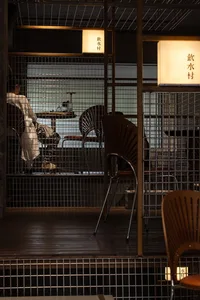Cozy restaurant interior with multiple chairs and dining tables, inviting atmosphere, and various seating options