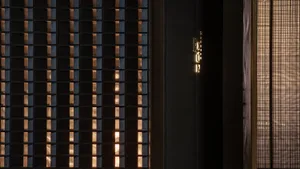 A dimly lit room with two doorways, one on the left and one on the right, creating a sense of mystery