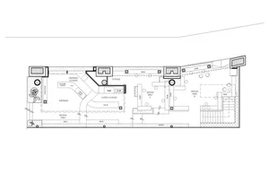 2D floor plan of a modern coffee shop with various rooms and functional details