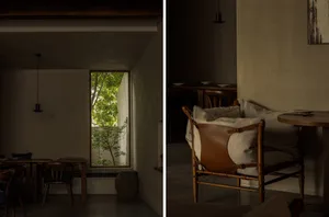 Cozy living space with furniture, a potted plant, and a patio area with a chair and dining table