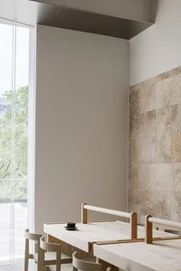 Empty bathroom with a white wall and beige tiles on the floor, featuring two wooden benches and a clean, minimalistic atmosphere
