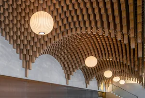 Warm and cozy interior space with wooden walls and ceiling, illuminated by hanging lights