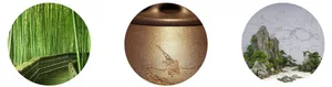 A gold bird sculpture with intricate details on a metal surface, highlighted by the lighting