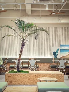 Cozy modern cafe with white walls, comfortable seating, and soft warm lighting