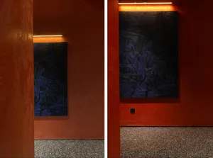 Two blue paintings on display in an art gallery with a focus on artistic and creative environment