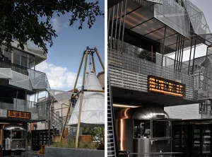 Modern building with metal and wood elements, featuring a large clock tower and detailed interior, with contrasting textures and materials