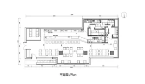 2D floor plan of a modern office space with multiple seating areas, tables, and chairs, featuring a functional and open layout