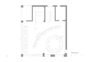 A modern floor plan with multiple seating areas, chairs, and dining tables, featuring a functional and inviting design