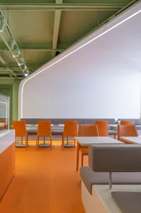 A clean and inviting restaurant with multiple dining tables and chairs, ready for customers