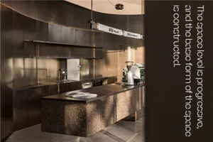 Industrial kitchen with stainless steel surfaces, modern appliances, and clean lines, suitable for food preparation and cooking