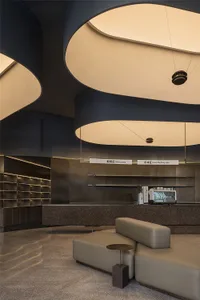 Inviting restaurant interior with a counter, dining table, chairs, and a coffee machine, creating a comfortable atmosphere for dining
