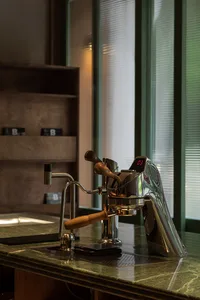 A well-organized kitchen area with a coffee maker, two cups, and a countertop