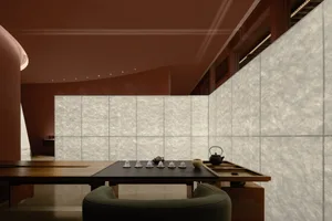 A dimly lit dining space with a modern aesthetic, featuring a wood dining table and chairs, and glass accents