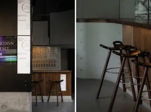A bar with wooden tables and chairs, offering multiple seating options for socializing and enjoying drinks