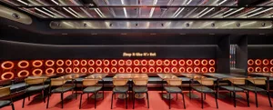 A restaurant dining area with multiple tables and chairs, creating a comfortable atmosphere for guests to enjoy their meals