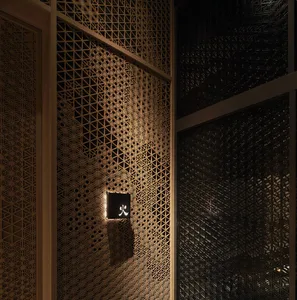 Interior space with a hexagonal patterned wall, wooden walls, and two doors, creating an inviting and comfortable atmosphere